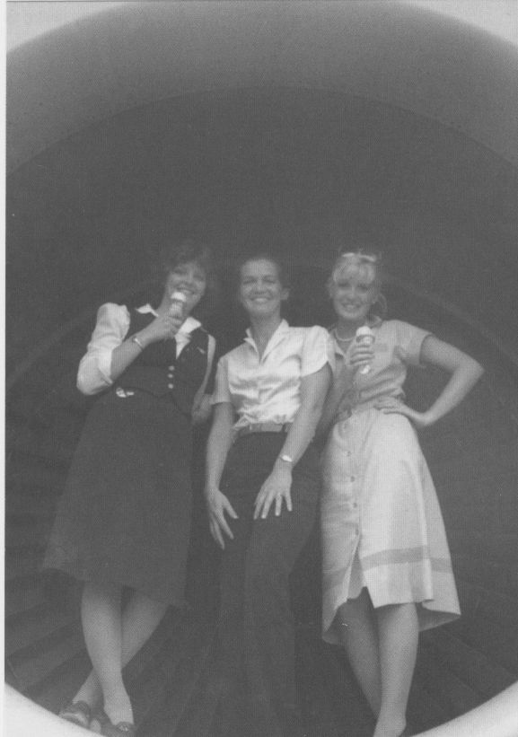 1980s Three Pan Am Flight Attendants pose in the engine cowling of a 747.